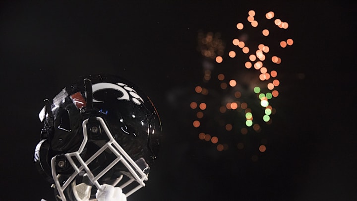 Cincinnati Bearcats player lifts his helmet after the Birmingham Bowl between Cincinnati Bearcats and Boston College Eagles on Thursday, Jan. 2, 2020, at Legion Field in Birmingham, Ala. Cincinnati Bearcats wont 38-6.

Birmingham Bowl