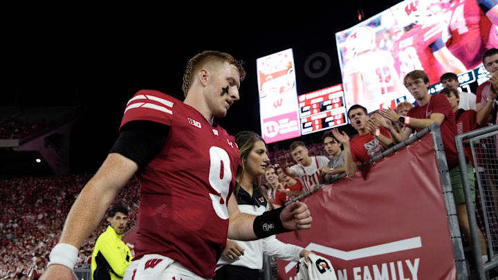 Aug 28, 2025; Madison, Wisconsin, USA;  Wisconsin Badgers quarterback Billy Edwards Jr. (9) walks to the locker room after being injured during the second quarter against the Miami (OH) RedHawks at Camp Randall Stadium. Mandatory Credit: Jeff Hanisch-Imagn Images