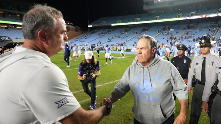 North Carolina coach Bill Belichick shakes hands with TCU coach Sonny Dykes after the Horned Frogs victory last month