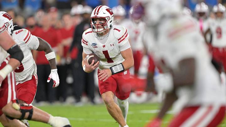 Oct 17, 2026; Pasadena, California, USA;  Wisconsin Badgers quarterback Colton Joseph (1) carries the ball to the 4 yard line in the second half against the UCLA Bruins at the Rose Bowl. Mandatory Credit: Jayne Kamin-Oncea-Imagn Images