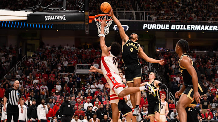 Mar 28, 2026; San Jose, CA, USA; Purdue Boilermakers forward Trey Kaufman-Renn (4) blocks a shot by Arizona Wildcats forward Koa Peat (10) in the second half during an Elite Eight game of the West Regional of the men's 2026 NCAA Tournament at SAP Center. Mandatory Credit: Eakin Howard-Imagn Images