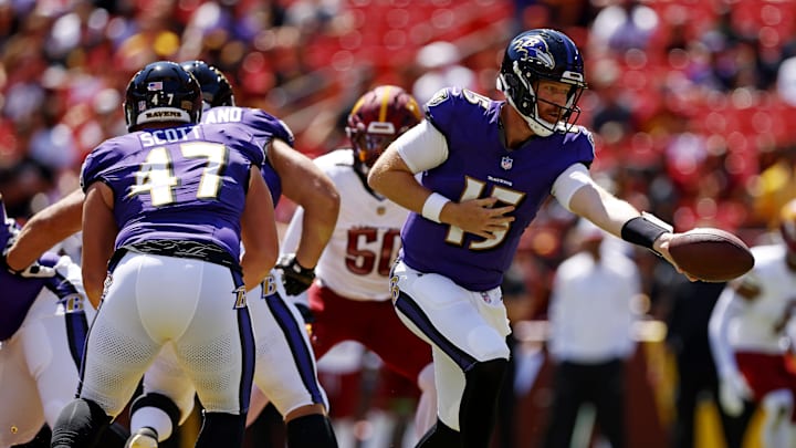Aug 23, 2025; Landover, Maryland, USA; Baltimore Ravens quarterback Cooper Rush (15) hands the ball off during the first quarter against the Washington Commanders at Northwest Stadium. Mandatory Credit: Peter Casey-Imagn Images Aug 23, 2025; Landover, Maryland, USA; Baltimore Ravens quarterback Cooper Rush (15) hands the ball off during the first quarter against the Washington Commanders at Northwest Stadium. Mandatory Credit: Peter Casey-Imagn Images