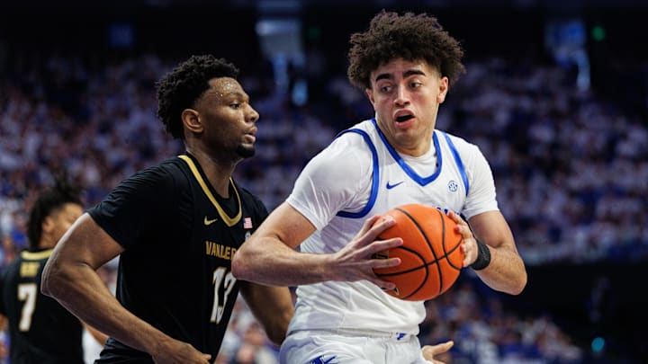 Feb 28, 2026; Lexington, Kentucky, USA; Kentucky Wildcats center Malachi Moreno (24) spins to the basket around Vanderbilt Commodores forward Jalen Washington (13) during the second half at Rupp Arena at Central Bank Center. Mandatory Credit: Jordan Prather-Imagn Images