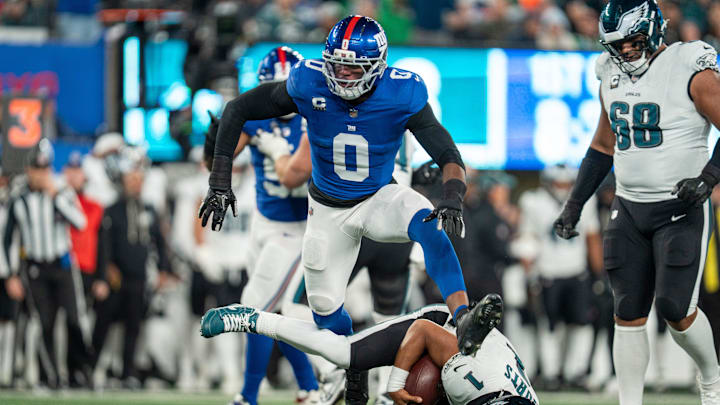 New York Giants Brian Burns sacks Philadelphia Eagles quarterback Jalen Hurts (1) during a Thursday Night Football game between the New York Giants and the Philadelphia Eagles at MetLife Stadium in East Rutherford on Oct. 9, 2025.