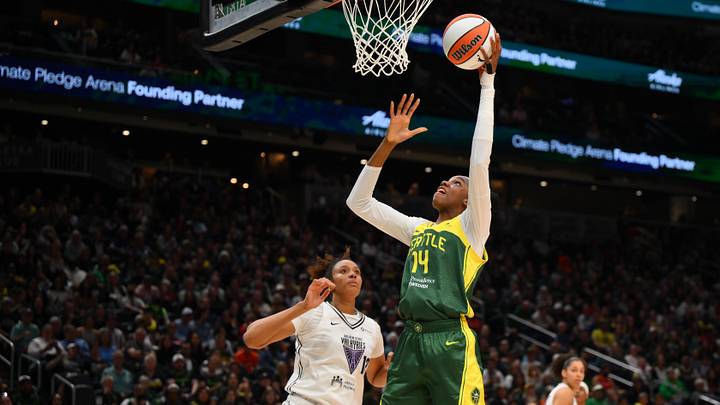 Sep 9, 2025; Seattle, Washington, USA; Seattle Storm center Dominique Malonga (14) shoots a layup against the Golden State Valkyries during the first half at Climate Pledge Arena. Mandatory Credit: Steven Bisig-Imagn Images