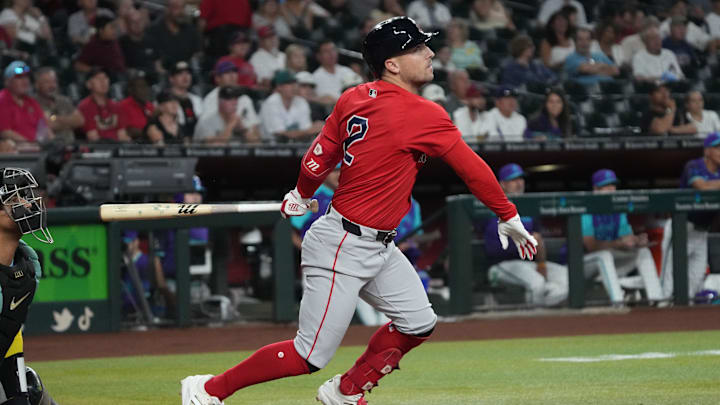 Sep 5, 2025; Phoenix, Arizona, USA; Boston Red Sox third base Alex Bregman (2) hits against the Arizona Diamondbacks in the first inning at Chase Field. Mandatory Credit: Rick Scuteri-Imagn Images