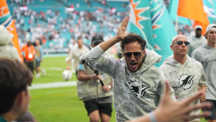 Miami Dolphins head coach Mike McDaniel runs off the field following a victory over the Las Vegas Raiders at Hard Rock Stadium.