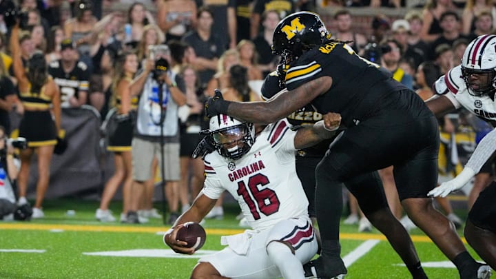 Sep 20, 2025; Columbia, Missouri, USA; South Carolina Gamecocks quarterback LaNorris Sellers (16) is sacked by Missouri Tigers defensive tackle Chris McClellan (7) and defensive end Damon Wilson II (8) during the first half of the game at Faurot Field at Memorial Stadium. Mandatory Credit: Denny Medley-Imagn Images Sep 20, 2025; Columbia, Missouri, USA; South Carolina Gamecocks quarterback LaNorris Sellers (16) is sacked by Missouri Tigers defensive tackle Chris McClellan (7) and defensive end Damon Wilson II (8) during the first half of the game at Faurot Field at Memorial Stadium. Mandatory Credit: Denny Medley-Imagn Images