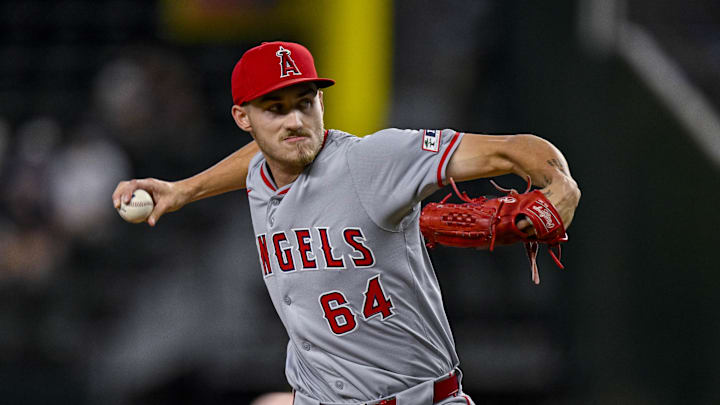 Sep 5, 2024; Arlington, Texas, USA; Los Angeles Angels starting pitcher Jack Kochanowicz (64) pitches against the Texas Rangers during the first inning at Globe Life Field. Mandatory Credit: Jerome Miron-Imagn Images Sep 5, 2024; Arlington, Texas, USA; Los Angeles Angels starting pitcher Jack Kochanowicz (64) pitches against the Texas Rangers during the first inning at Globe Life Field. Mandatory Credit: Jerome Miron-Imagn Images