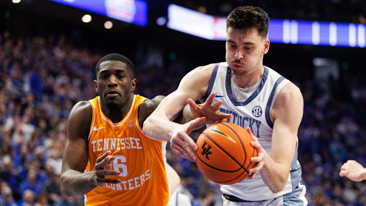 Feb 7, 2026; Lexington, Kentucky, USA; Kentucky Wildcats forward Andrija Jelavic (4) grabs a rebound against Tennessee Volunteers forward Dewayne Brown II (6) during the first half at Rupp Arena at Central Bank Center. Mandatory Credit: Jordan Prather-Imagn Images
