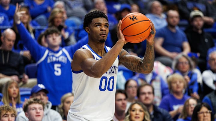 Jan 24, 2026; Lexington, Kentucky, USA; Kentucky Wildcats guard Otega Oweh (00) shoots and makes a three pointer during game against the Mississippi Rebels at Rupp Arena at Central Bank Center. Mandatory Credit: Jordan Prather-Imagn Images