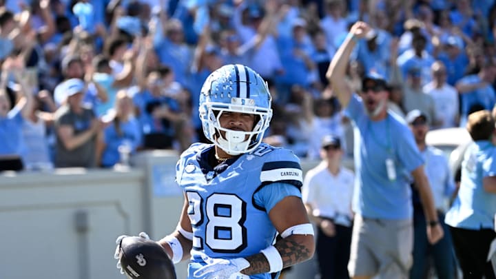 Oct 12, 2024; Chapel Hill, North Carolina, USA; North Carolina Tar Heels running back Omarion Hampton (28) runs for a touchdown in the third quarter at Kenan Memorial Stadium. Mandatory Credit: Bob Donnan-Imagn Images Oct 12, 2024; Chapel Hill, North Carolina, USA; North Carolina Tar Heels running back Omarion Hampton (28) runs for a touchdown in the third quarter at Kenan Memorial Stadium. Mandatory Credit: Bob Donnan-Imagn Images