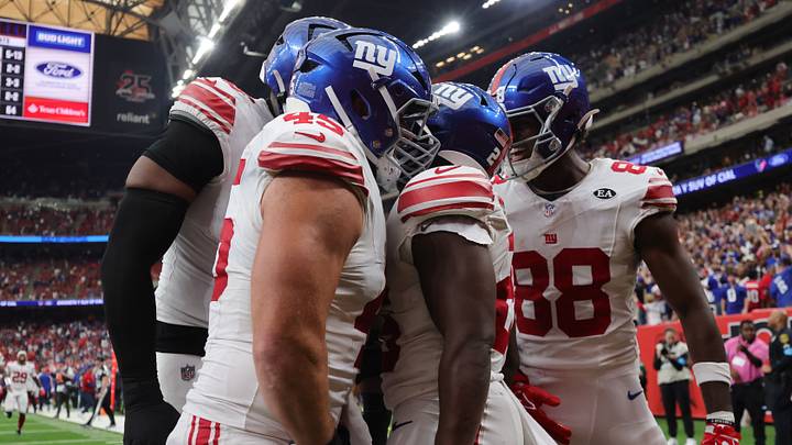 Oct 25, 2026; Houston, Texas, USA;  New York Giants running back Devin Singletary (26) celebrates his game winning touchdown with his teammates against the Houston Texans in overtime at Reliant Stadium.  