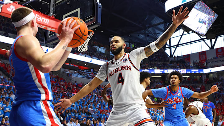 Feb 1, 2025; Oxford, Mississippi, USA; Auburn Tigers forward/center Johni Broome (4) defends as Mississippi Rebels guard Sean Pedulla (3) in bounds the ball during the second half at The Sandy and John Black Pavilion at Ole Miss. Mandatory Credit: Petre Thomas-Imagn Images