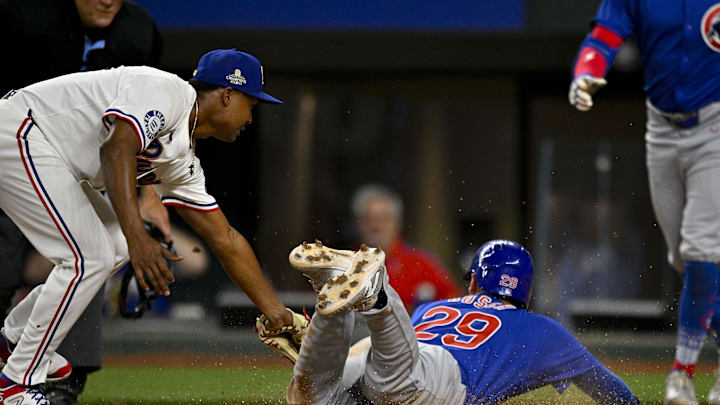 Mar 31, 2024; Arlington, Texas, USA; Chicago Cubs first baseman Michael Busch (29) scores the go