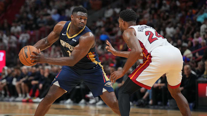 Mar 22, 2024; Miami, Florida, USA;  New Orleans Pelicans forward Zion Williamson (1) brings the ball up the court as Miami Heat forward Haywood Highsmith (24) during the first half at Kaseya Center. Mandatory Credit: Jim Rassol-Imagn Images