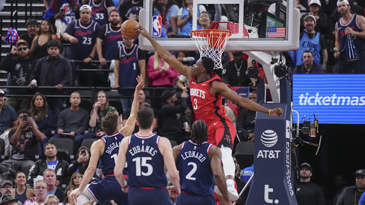 Apr 9, 2025; Inglewood, California, USA; Houston Rockets center N'Faly Dante (3) block Los Angeles Clippers guard Bogdan Bogdanovic (10) in the second half at Intuit Dome. Mandatory Credit: Kirby Lee-Imagn Images