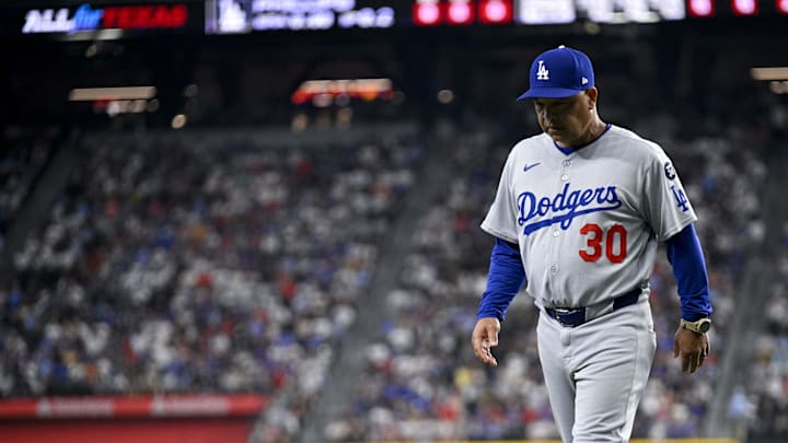Apr 20, 2025; Arlington, Texas, USA; Los Angeles Dodgers manager Dave Roberts (30) walks back to the dugout during the eighth inning against the Texas Rangers at Globe Life Field. Apr 20, 2025; Arlington, Texas, USA; Los Angeles Dodgers manager Dave Roberts (30) walks back to the dugout during the eighth inning against the Texas Rangers at Globe Life Field.