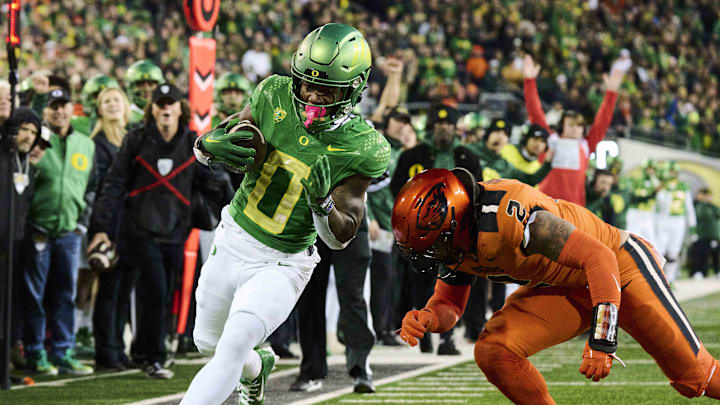 Nov 24, 2023; Eugene, Oregon, USA; Oregon Ducks running back Bucky Irving (0) scores a touchdown