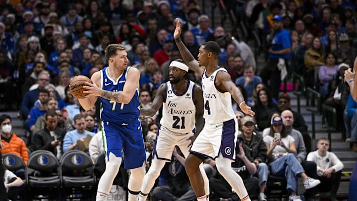 Dec 25, 2022; Dallas, Texas, USA; Dallas Mavericks guard Luka Doncic (77) and Los Angeles Lakers guard Patrick Beverley (21) and guard Lonnie Walker IV (4) in action during the game between the Dallas Mavericks and the Los Angeles Lakers at American Airlines Center. Mandatory Credit: Jerome Miron-Imagn Images