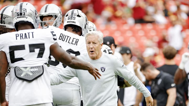 Sep 21, 2025; Landover, Maryland, USA; The Las Vegas Raiders head coach Pete Carroll huddles with the team before the game against the Washington Commanders at Northwest Stadium. Mandatory Credit: Amber Searls-Imagn Images