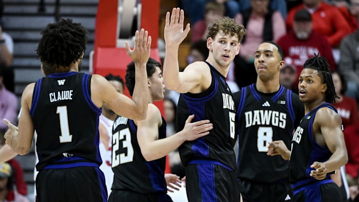 Jan 4, 2026; Bloomington, Indiana, USA; Washington Huskies guard Desmond Claude (1) and Washington Huskies forward Hannes Steinbach (6) high-five after a play against the Indiana Hoosiers during the first half at Simon Skjodt Assembly Hall. Mandatory Credit: Robert Goddin-Imagn Images Jan 4, 2026; Bloomington, Indiana, USA; Washington Huskies guard Desmond Claude (1) and Washington Huskies forward Hannes Steinbach (6) high-five after a play against the Indiana Hoosiers during the first half at Simon Skjodt Assembly Hall. Mandatory Credit: Robert Goddin-Imagn Images