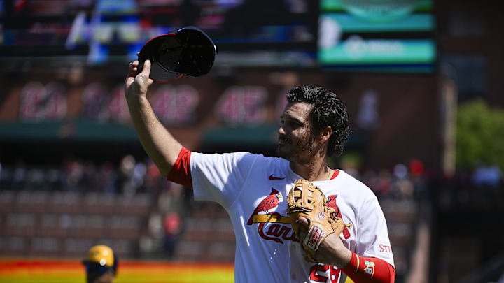 Sep 21, 2025; St. Louis, Missouri, USA; St. Louis Cardinals third baseman Nolan Arenado (28) salutes the fans after he was ceremonially removed before the start of the first inning against the Milwaukee Brewers at Busch Stadium. Mandatory Credit: Jeff Curry-Imagn Images