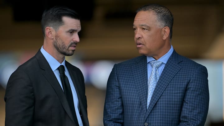 Jan 22, 2025; Los Angeles, CA, USA;  L-R; Los Angeles Dodgers General Manager Brandon Gomes talks with manager Dave Roberts (30) during a press conference at Dodger Stadium. Mandatory Credit: Jayne Kamin-Oncea-Imagn Images  