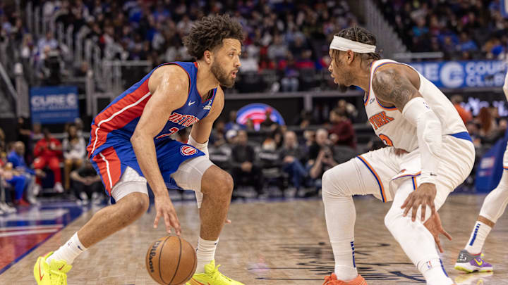 Apr 10, 2025; Detroit, Michigan, USA; New York Knicks guard Miles McBride (2) defends against Detroit Pistons guard Cade Cunningham (2) during the second half at Little Caesars Arena. Mandatory Credit: David Reginek-Imagn Images
