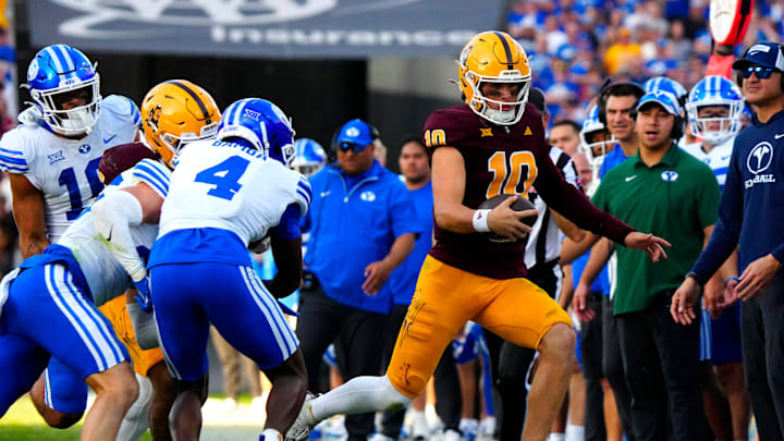 Arizona State quarterback Sam Leavitt (10) sprints out of bounds during the second half against BYU at Mountain America Stadium in Tempe on Nov. 23, 2024. Arizona State quarterback Sam Leavitt (10) sprints out of bounds during the second half against BYU at Mountain America Stadium in Tempe on Nov. 23, 2024.