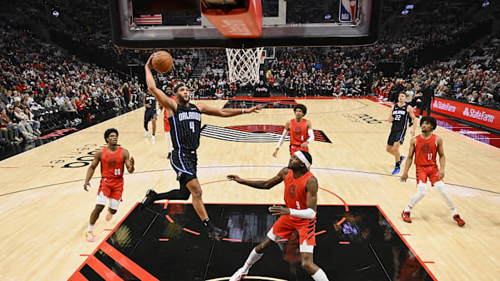 Oct 27, 2023; Portland, Oregon, USA; Orlando Magic guard Jalen Suggs (4) scores a basket during the first half against Portland Trail Blazers forward Jerami Grant (9) at Moda Center. Mandatory Credit: Troy Wayrynen-Imagn Images Oct 27, 2023; Portland, Oregon, USA; Orlando Magic guard Jalen Suggs (4) scores a basket during the first half against Portland Trail Blazers forward Jerami Grant (9) at Moda Center. Mandatory Credit: Troy Wayrynen-Imagn Images