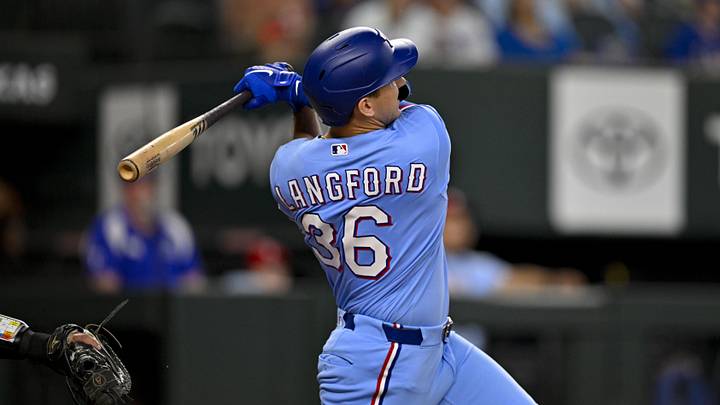 Jun 21, 2026; Arlington, Texas, USA; Texas Rangers center fielder Wyatt Langford (36) hits a three run home run against the San Diego Padres during the third inning at Globe Life Field. Mandatory Credit: Jerome Miron-Imagn Images