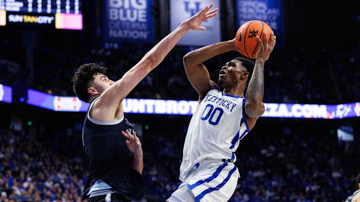 Oct 30, 2025; Lexington, KY, USA; Kentucky Wildcats guard Otega Oweh (00) shoots the ball against Georgetown Hoyas center Julius Halaifonua (11) during the second half at Rupp Arena at Central Bank Center. Mandatory Credit: Jordan Prather-Imagn Images