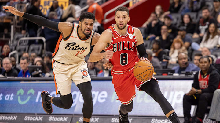 Nov 18, 2024; Detroit, Michigan, USA; Detroit Pistons forward Tobias Harris (12) defends against Chicago Bulls guard Zach LaVine (8) during the second half at Little Caesars Arena. Mandatory Credit: David Reginek-Imagn Images