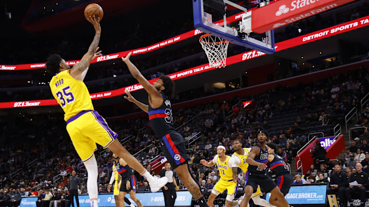 Nov 29, 2023; Detroit, Michigan, USA; Los Angeles Lakers forward Christian Wood (35) shoots on Detroit Pistons forward Marvin Bagley III (35) in the first half at Little Caesars Arena. Mandatory Credit: Rick Osentoski-Imagn Images