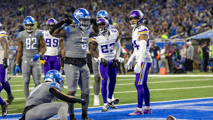 Jan 7, 2024; Detroit, Michigan, USA; Detroit Lions running back David Montgomery (5) flexes his muscles after scoring against the Minnesota Vikings.