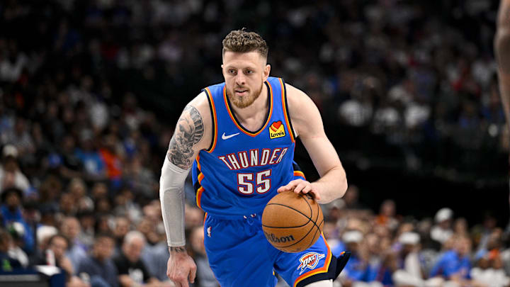 Mar 1, 2026; Dallas, Texas, USA; Oklahoma City Thunder center Isaiah Hartenstein (55) controls the ball during the game between the Mavericks and the Thunder at American Airlines Center. Mandatory Credit: Jerome Miron-Imagn Images