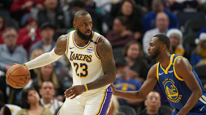 Dec 25, 2024; San Francisco, California, USA; Los Angeles Lakers forward LeBron James (23) dribbles against Golden State Warriors forward Andrew Wiggins (22) during the third quarter at Chase Center. Mandatory Credit: Darren Yamashita-Imagn Images Dec 25, 2024; San Francisco, California, USA; Los Angeles Lakers forward LeBron James (23) dribbles against Golden State Warriors forward Andrew Wiggins (22) during the third quarter at Chase Center. Mandatory Credit: Darren Yamashita-Imagn Images