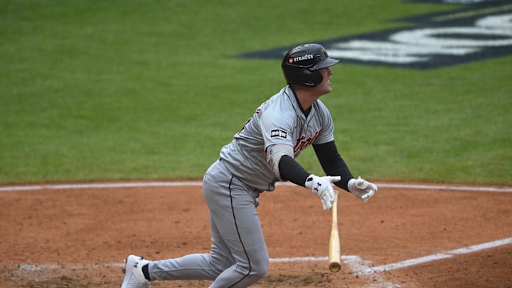 Detroit Tigers outfielder Kerry Carpenter (30) hits a single in the fifth inning against the Cleveland Guardians during game five of the ALDS for the 2024 MLB Playoffs at Progressive Field on Oct 12.