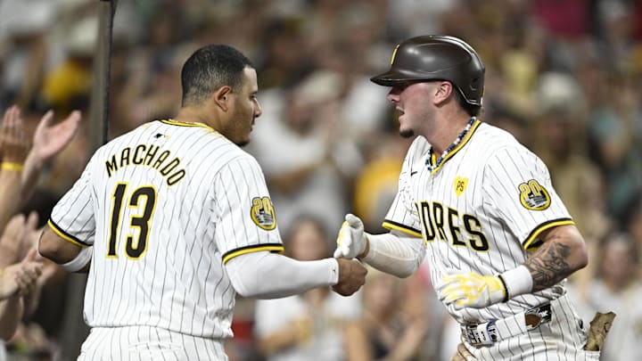 Sep 4, 2024; San Diego, California, USA; San Diego Padres center fielder Jackson Merrill (3) is congratulated by Manny Machado (13) after hitting a three-run home run during the fourth inning against the Detroit Tigers at Petco Park. Mandatory Credit: Denis Poroy-Imagn Images Sep 4, 2024; San Diego, California, USA; San Diego Padres center fielder Jackson Merrill (3) is congratulated by Manny Machado (13) after hitting a three-run home run during the fourth inning against the Detroit Tigers at Petco Park. Mandatory Credit: Denis Poroy-Imagn Images