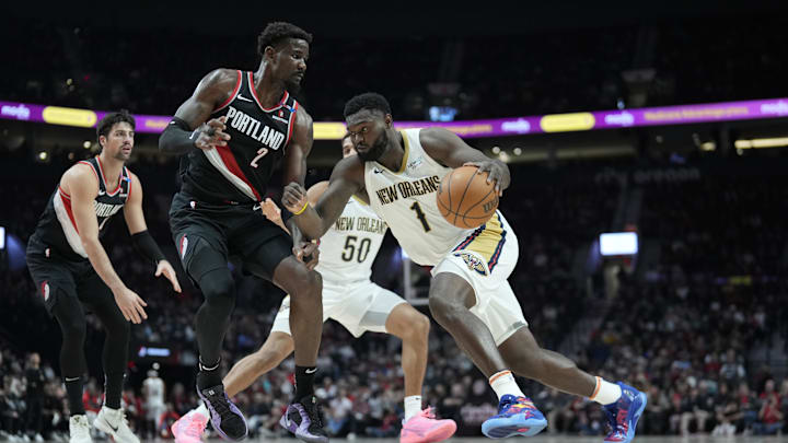 Oct 25, 2024; Portland, Oregon, USA; New Orleans Pelicans power forward Zion Williamson (1) dribbles the ball while defended by Portland Trail Blazers center Deandre Ayton (2) during the first half at Moda Center. Mandatory Credit: Soobum Im-Imagn Images Oct 25, 2024; Portland, Oregon, USA; New Orleans Pelicans power forward Zion Williamson (1) dribbles the ball while defended by Portland Trail Blazers center Deandre Ayton (2) during the first half at Moda Center. Mandatory Credit: Soobum Im-Imagn Images