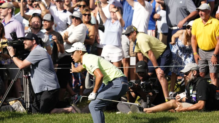 Collin Morikawa reacts after chipping onto the green on No.18 Collin Morikawa reacts after chipping onto the green on No.18