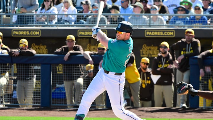 Luke Raley (20) singles in the first inning against the San Diego Padres during a Spring Training game.