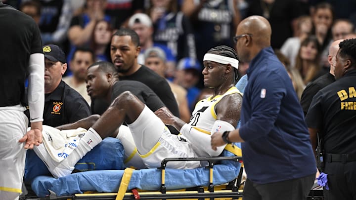 Oct 28, 2024; Dallas, Texas, USA; Utah Jazz forward Taylor Hendricks (0) is taken off the court after suffering a leg injury during the second half against the Dallas Mavericks at the American Airlines Center. Mandatory Credit: Jerome Miron-Imagn Images Oct 28, 2024; Dallas, Texas, USA; Utah Jazz forward Taylor Hendricks (0) is taken off the court after suffering a leg injury during the second half against the Dallas Mavericks at the American Airlines Center. Mandatory Credit: Jerome Miron-Imagn Images