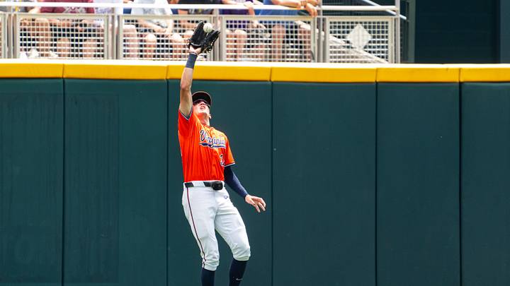 Jun 16, 2024; Omaha, NE, USA; Virginia Cavaliers center fielder Harrison Didawick (34) gets an out against the Florida State Seminoles during the first inning at Charles Schwab Field Omaha. Mandatory Credit: Dylan Widger-Imagn Images Jun 16, 2024; Omaha, NE, USA; Virginia Cavaliers center fielder Harrison Didawick (34) gets an out against the Florida State Seminoles during the first inning at Charles Schwab Field Omaha. Mandatory Credit: Dylan Widger-Imagn Images