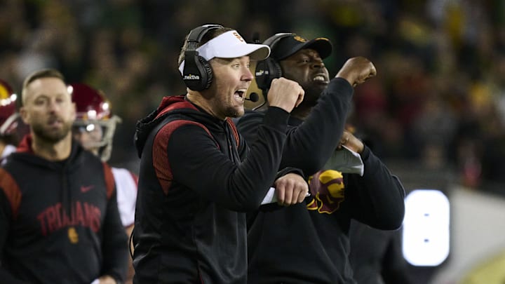 Nov 11, 2023; Eugene, Oregon, USA; USC Trojans head coach Lincoln Riley signals to the offense during the second half against the Oregon Ducks at Autzen Stadium. 