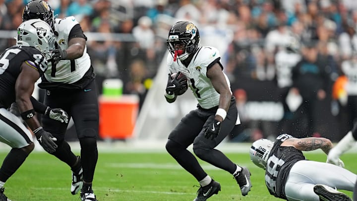 Nov 2, 2025; Paradise, Nevada, USA; Jacksonville Jaguars running back Travis Etienne Jr. (1) runs the ball during the first half against the Las Vegas Raiders at Allegiant Stadium. Mandatory Credit: Kirby Lee-Imagn Images Nov 2, 2025; Paradise, Nevada, USA; Jacksonville Jaguars running back Travis Etienne Jr. (1) runs the ball during the first half against the Las Vegas Raiders at Allegiant Stadium. Mandatory Credit: Kirby Lee-Imagn Images