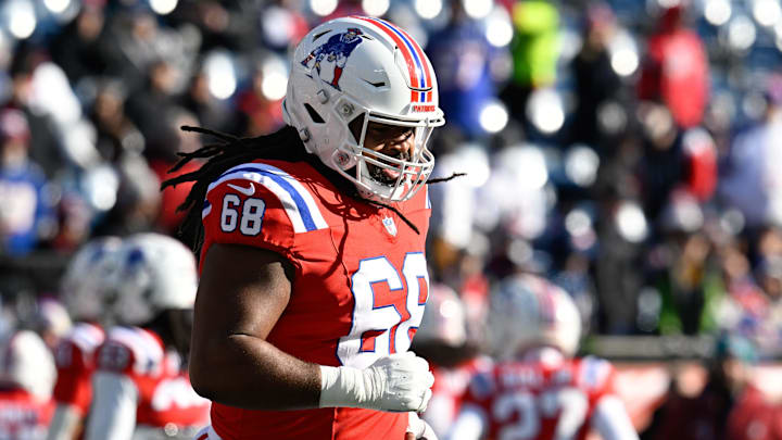 Dec 1, 2024; Foxborough, Massachusetts, USA; New England Patriots center Lecitus Smith (68) warms up before a game against the Indianapolis Colts at Gillette Stadium. Mandatory Credit: Eric Canha-Imagn Images