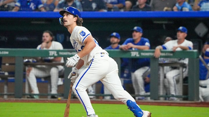 Sep 17, 2025; Kansas City, Missouri, USA; Kansas City Royals second baseman Adam Frazier (26) hits a two run home run against the Seattle Mariners during the eighth inning at Kauffman Stadium. Mandatory Credit: Denny Medley-Imagn Images