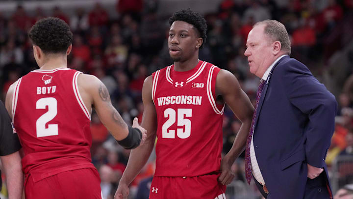 Wisconsin head coach Greg Gard talks with guard John Blackwell (25) during the second half of their quarterfinal game in the Big Ten tournament.